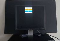 Front view powered on showing Dell logo menu on screen