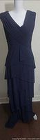 Full front view of navy tiered dress on mannequin