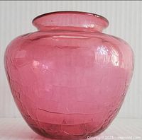 Front view of cranberry crackle glass rose bowl