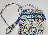 Front view of quilted crossbody with strap