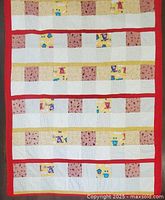 Full view of patchwork quilt showing overall pattern and red border