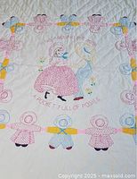 Full view of quilt showing Ring Around the Rosie design and overall condition