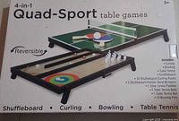 Front of box showing Quad-Sport 4-in-1 tabletop game images