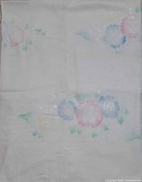 Full view of tablecloth showing overall pattern and white background