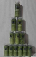 Front view showing 12 stacked Rituals body lotion bottles