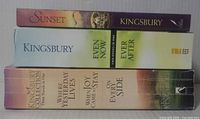 Spines of the three paperback volumes showing titles Sunset, Even Now/Ever After, Where Yesterday Lives/When Joy Came to Stay/On Every Side