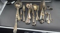 All flatware laid out showing variety and quantity