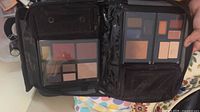 Open makeup organizer showing two magnetic palettes