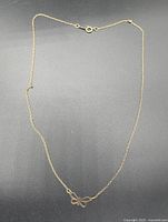 Full view of necklace showing chain, butterfly pendant and clasp