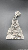 Front view of sterling silver religious figure pendant