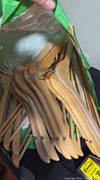 Bag filled with wooden hangers