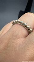 ring on finger showing bead pattern