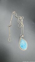 Full view of sterling snake chain and larimar pendant