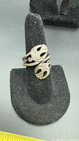 Ring on stand showing twin snake head design