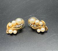 Front view of both earrings showing leaf design, pearls and rhinestones