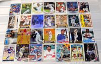 Overview of all 28 baseball cards laid out in four rows