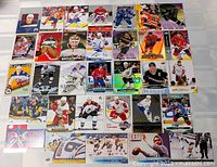 All 32 hockey cards laid out in four rows
