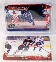 Group shot showing both oversized hockey cards in sleeves