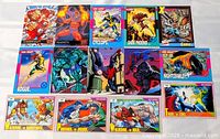 All 14 Marvel trading cards laid out in rows showing fronts and character names