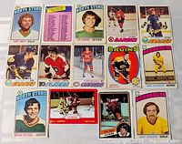 All 14 vintage hockey cards laid out front side up