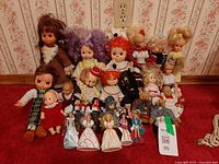 Group shot of all dolls on carpeted floor