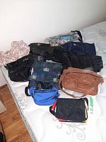 All ten bags spread on mattress for overview
