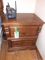 Nightstand front showing two drawers and hardware