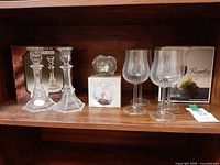 Full lot showing 4 wine glasses, 2 candlesticks, Iceberg holder and their boxes
