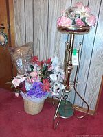 Plant stand with all floral pieces beside and atop