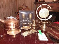 Full group view of brass and copper decorative items