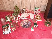 Overall view of assorted Christmas decorations spread on carpet