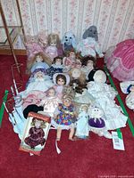 Group of all dolls and stands on carpet