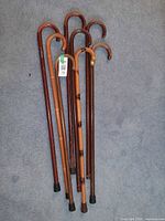 Group of eight canes laid on carpet