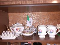 Entire grouping on shelf showing all ceramic pieces together