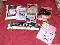 Group shot of all seven packaged items on red carpet