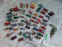 Top view of full assortment of vehicles, figures and marbles