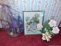 Full view of cross-stitch and both floral arrangements