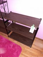 Front angled view of three-tier shelving unit