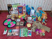 Overview of all 1990s toys and memorabilia spread on carpet