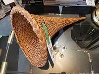 Top view of rattan cornucopia showing interior weave and rim detail