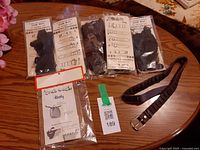 Four sealed Link Belt kits, Grab Bag kit, assembled belt displayed on tabletop