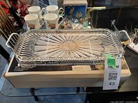 Tray with glass insert placed on original box