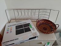 Boxed Triomph electronic weight scale, metal bath caddy, wicker basket