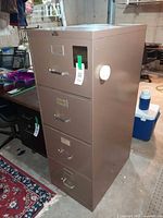 Front and side view of Steelcase 4-drawer metal filing cabinet