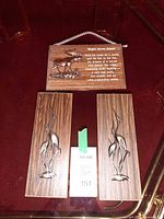 Overview of three wooden plaques on surface