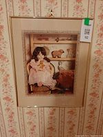 Framed print front view hanging on floral wallpaper