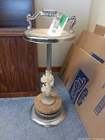 Full view of chrome standing ashtray showing overall form and dimensions