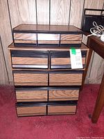 Front view of all five stacked faux woodgrain drawer units
