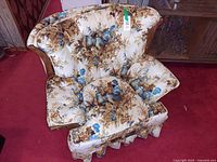 Front view of upholstered floral armchair
