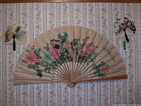 All three folding wall fans mounted on wall